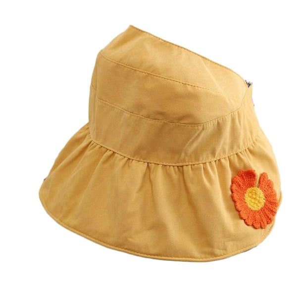 Babys yellow sun hat with flower pattern.